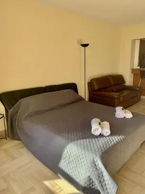 a bedroom with a bed with two towels on it at Gray d'Albion POL519 studio in Cannes