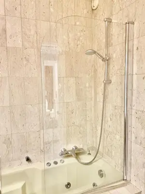 a shower with a glass door in a bathroom at Gray d'Albion POL519 studio in Cannes