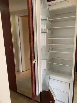 an open door of an empty refrigerator with the door open at Gray d'Albion POL519 studio in Cannes