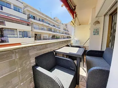 a balcony with two chairs and a table on a building at Imperial Croisette FER3417 studio in Cannes