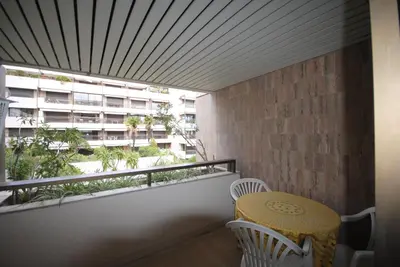 a balcony with a table and chairs and a building at Gray d'Albion VIM1163 studio in Cannes