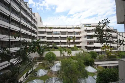 an apartment building with a garden in front of it at Gray d'Albion VIM1163 studio in Cannes
