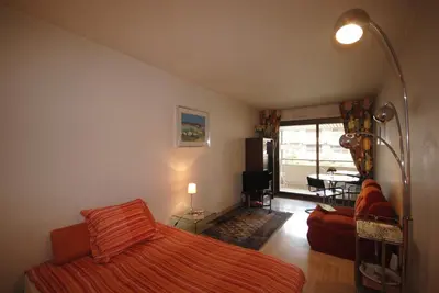 a bedroom with a bed and a living room at Gray d'Albion VIM1163 studio in Cannes
