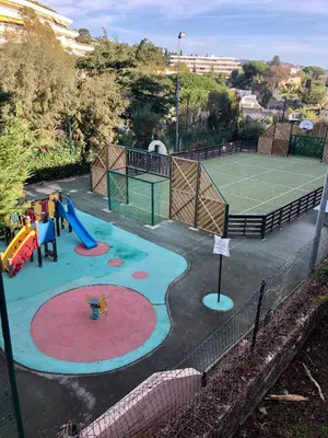 a playground with a tennis court and a tennis at T2 superbe vue mer Cannes in Cannes