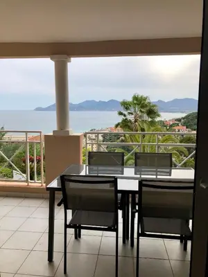 a dining room with a view of the ocean at T2 superbe vue mer Cannes in Cannes