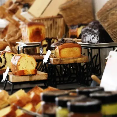 a bunch of different types of bread on shelves at Juliana Hotel Cannes in Cannes