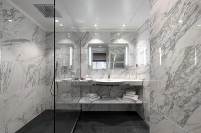 a bathroom with a sink and a mirror at Juliana Hotel Cannes in Cannes