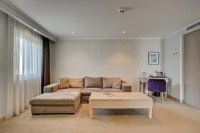 a living room with a couch and a coffee table at Juliana Hotel Cannes in Cannes