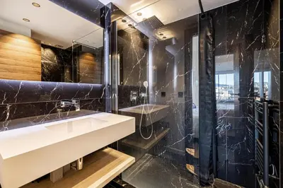 a bathroom with a sink and a shower at Appartements Croisette Grand Hôtel in Cannes