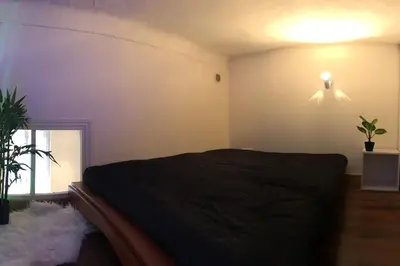 a bedroom with a bed and a ceiling fan at Centre ville 10 min de la Croisette/Downtown in Cannes