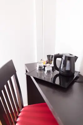 a black table with a coffee maker on top of it at Esperanto in Cannes