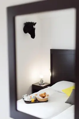 a tray of food sitting on top of a bed at Esperanto in Cannes