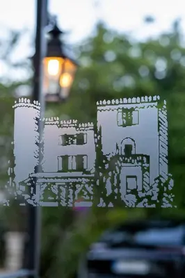 a picture of a castle on a street light at Hôtel Château de la Tour Cannes in Cannes