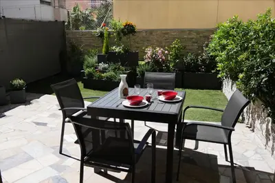a black table and chairs on a patio at Studio Terrasse in Cannes