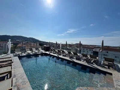 a swimming pool on the roof of a building at Best Western Plus Cannes Riviera & SPA in Cannes