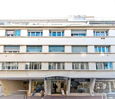 a white building with people walking in front of it at ATH hôtel Athénée in Cannes