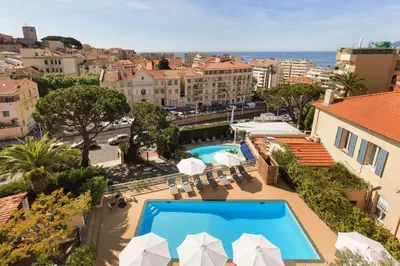 arial view of a hotel with a swimming pool at Best Western Hôtel des Orangers Cannes in Cannes