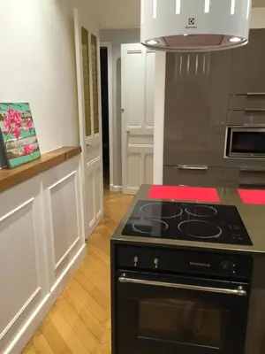 a kitchen with a black stove top oven at central CANNES - Luxury Clara Residence in Cannes