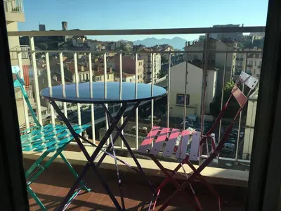 a table and chairs on a balcony with a view at Studio Appartement Cannes Centre - 5 min à pied du Palais des Festivals et Congrès in Cannes