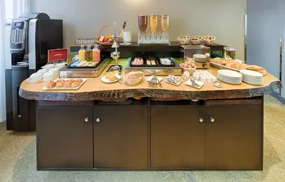 a breakfast counter with food on it in a room at Hôtel La Villa Tosca in Cannes
