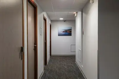 a corridor of an office building with a hallway at L'Esterel in Cannes