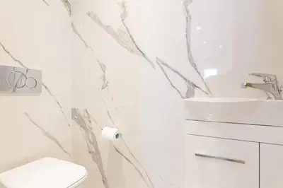 a bathroom with a sink and a toilet at On La Croisette: new 2 bedrooms with sea view in Cannes