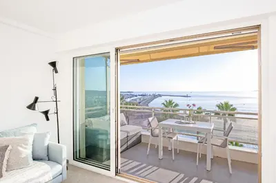 a living room with a view of the ocean at On la Croisette: luxe 2 bedrooms/ 2 baths in Cannes