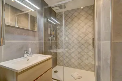 a bathroom with a sink and a shower at IMMOGROOM - AC - 5min from the beaches 8 min from Palais in Cannes