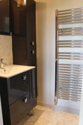 a bathroom with a sink and a shower at Rooftop grande terrasse jacuzzi vue mer in Cannes