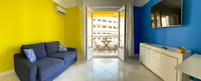 a living room with a couch and a table at PASTEUR in Cannes