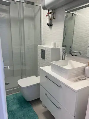 a bathroom with a sink and a toilet and a shower at PASTEUR in Cannes