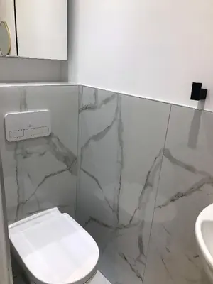 a bathroom with a white toilet and a sink at Studio contemporain à Cannes avec terrasse et parking - 35 m² in Cannes
