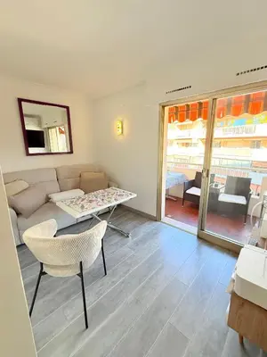 a living room with a couch and a table at Le Gallieni in Cannes
