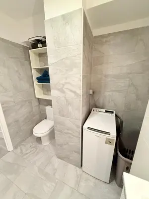 a small bathroom with a toilet and a sink at Le Gallieni in Cannes