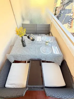 a table sitting on top of a balcony at Le Gallieni in Cannes