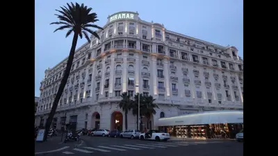 a large white building with cars parked in front of it at 124 MIRAMAR 65 LA CROISETTE in Cannes