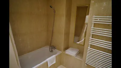 a bathroom with a bath tub and a shower at 124 MIRAMAR 65 LA CROISETTE in Cannes
