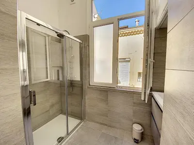 a bathroom with a shower and a glass door at Lecerf 2P ZEI5517 in Cannes