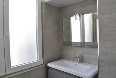 a bathroom with a sink and a mirror at Lecerf 2P ZEI5517 in Cannes