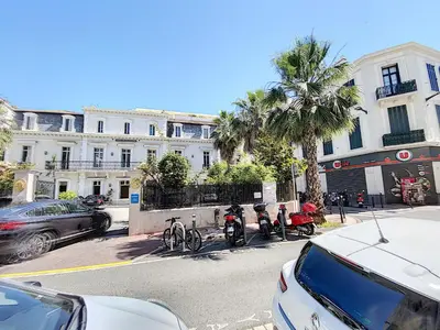 a group of motorcycles parked in front of a building at Lecerf 2P ZEI5517 in Cannes