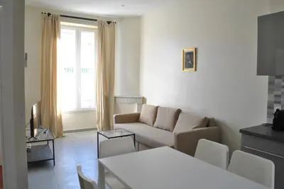 a living room with a couch and a table at Lecerf 2P ZEI5517 in Cannes