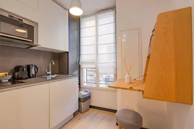 a kitchen with a counter and a sink and a window at Scandinavian Urban 1 - 2BR apartment in center close to Palais des Festivals and the beach in Cannes