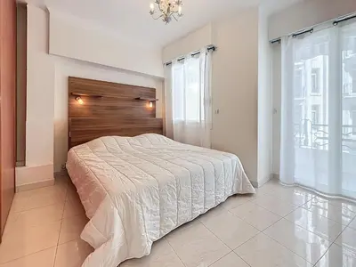 a bedroom with a bed and a large window at Luxury 1 bedroom Croisette Martinez direct sea view 241 in Cannes