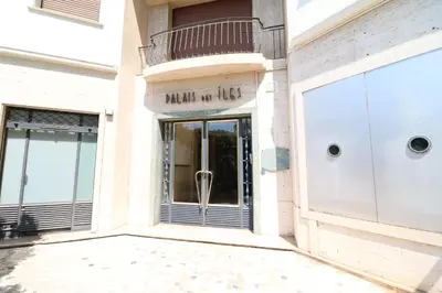 a facade of a building with a revolving door at Luxury 1 bedroom Croisette Martinez direct sea view 241 in Cannes