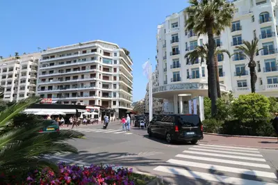 a car parked on a street in front of buildings at Luxury 1 bedroom Croisette Martinez direct sea view 241 in Cannes