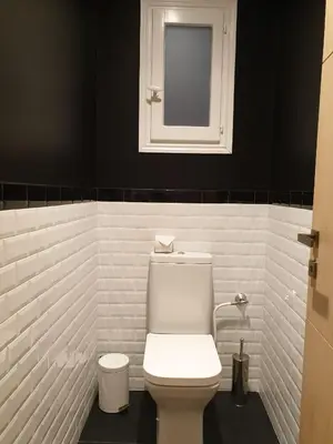 a bathroom with a white toilet and a mirror at Luxe et Confort - Proche Palais et plages - A/C in Cannes
