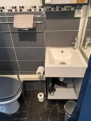 a bathroom with a sink and a toilet at STUDIO 45 CROISETTE CANNES in Cannes