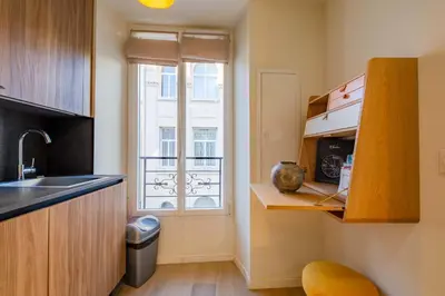 a kitchen with a sink and a window at Scandinavian Urban 3 - 2BR apartment in Cannes center - close to the beach and Palais in Cannes