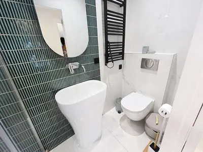 a bathroom with a toilet and a sink and a mirror at Fantastic penthouse 3 bedroom Croisette 406 in Cannes