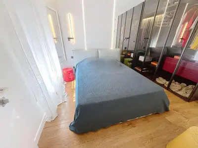 a bedroom with a bed with a blue blanket at Fantastic penthouse 3 bedroom Croisette 406 in Cannes